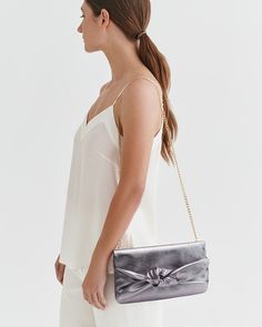 A fun finishing touch to your celebratory looks, made from luxurious Italian shimmer leather and lined in cotton twill, inspired by our bestselling Mini Bow Bag. Elegant Metallic Bags For Night Out, Elegant Silver Bag For Spring, Chic Bags For Gala, Luxury Party Bags For Spring, Elegant Bags For Night Out In Spring, Elegant Spring Bag For Night Out, Elegant Spring Night Out Bag, Chic Party Bags With Magnetic Closure, Chic Metallic Bag For Night Out