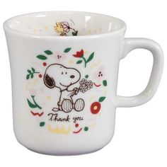 a white coffee cup with a snoopy design on the side and thank you written on it