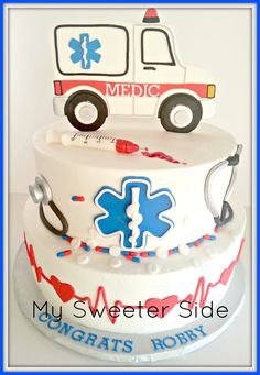 a medical themed cake with an ambulance on top