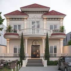 a car parked in front of a large white house with red roof and balconies