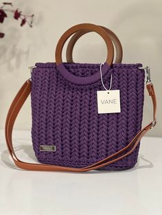 VANE Handmade Handbag Anita Crochet bag made of polyester yarn in the color plum - Removable, adjustable leather strap - Elegant wooden handles for a modern touch - High-quality inner pocket with small inner compartment - Dust bag, perfect for safe storage Dimensions: 23x29x12 cm Purple Everyday Bag With Adjustable Handle, Purple Bag With Adjustable Handle For Daily Use, Purple Bags With Adjustable Handle For Daily Use, Daily Use Purple Bag With Adjustable Handle, Purple Rectangular Bags With Adjustable Handle, Purple Travel Bag With Adjustable Handle, Travel Shoulder Bag With Adjustable Handle In Purple, Purple Travel Shoulder Bag With Adjustable Handle, Purple Top Handle Satchel With Adjustable Strap