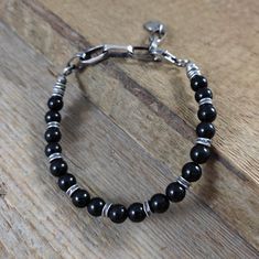 Sterling silver bracelet with  tourmaline, Bracelet with beads, Handmade jewelry, Oxidized silver Bracelet made of 925 silver and tourmaline. Silver oxidizes and polished. Length of the bracelet is 6.3/6.7/7.1/7.5/7.9 inches (16/17/18/19/20 cm), plus the regulatory chain 1.2/1.6/2/2.4 inches (3/4/5/6 cm). Length of bracelet in the picture is 6.9 inches (17.5 cm), plus the regulatory chain 2.4 inches (6 cm). The diameter of the stones: 0.26 inches (6.5 mm). The bracelet is packed in an elegant bo Sterling Silver Bracelets With Natural Stone Round Beads, Sterling Silver Bracelets With Round Natural Stone Beads, Spiritual Silver Pearl Bracelet With Gemstone Beads, Adjustable Sterling Silver Bracelet With Gemstone Beads, Modern Sterling Silver Bracelet With Silver Beads, Adjustable Silver Rosary Bracelet With Gemstone Beads, Modern Silver Bracelets With Gemstone Beads, Silver Onyx Beaded Bracelets Hand-strung, Hand-strung Silver Onyx Beaded Bracelets