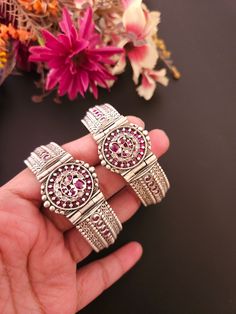 Add ethnicity and charm to your beautiful personality with these uniquely designed and handcrafted silver alike bangles. The intricate work gives combo set a very appealing and eye catching look.Pair them up with any semi formal or casual attire and win compliments for your unique choice! Material: brass Style: Boho & hippie Openable fits 2 '4 to 2 '8 Sterling Silver Temple Jewelry Bangle, Meenakari Jewelry Bracelet, Festive Bangle Cuff Bracelet, Festive Fusion Metal Bracelets, Sterling Silver Temple Jewelry Bracelet, Metal Temple Jewelry Toe Ring, Bohemian Silver Bangle Hand Set, Silver Bangle Bracelets For Festive Occasions, Silver Bangle For Festivals