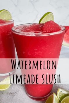 two glasses filled with watermelon limeade slush on top of a table