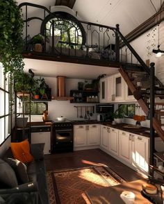 an open concept kitchen and living room with stairs