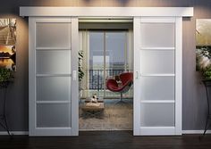 a living room with sliding glass doors leading to the balcony