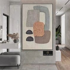 a painting hanging on the wall in a room