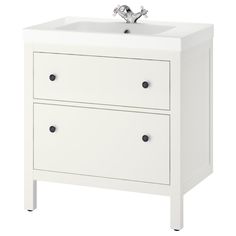 a white bathroom vanity with two drawers and a faucet on the sink side