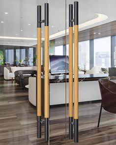 an office with wooden floors and glass partitions in front of the desk is shown