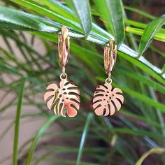 This Listing Is For 1 Pair Of The Gold Palm Leaf Huggie Earrings. Hoops Are 14k Gold Plated Lever Back. Palm Leafs Are Made Out Of Stainless Steel Rust Proof & Durable. Palm Leaf Is 16mm In Size These Earrings Could Be Paired With Any Outfit To Bring A Little Tropical Marine Life Flare To It. Very Dainty & Cute. Handmade By Distant Reflections Trendy Gold Hoop Earrings For Vacation, Summer Gift Yellow Gold Earrings, Trendy Dangle Hoop Earrings For Vacation, Gold Nickel-free Earrings For Vacation, Nickel-free Gold Earrings For Vacation, Gold Pierced Hoop Earrings For Beach, Trendy Gold Hoop Earrings For Beach, Handmade Gold Hoop Earrings For Vacation, Gold Hoop Earrings For Vacation