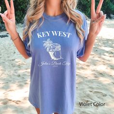 "Elevate your bachelorette party in style with our Classy Key West Bachelorette Shirts designed with a beach theme. These shirts embody a perfect blend of sophistication and seaside vibes, making them ideal for a classy and memorable celebration. Whether you're exploring the charming streets of Key West or lounging by the beach, these shirts will make you and your squad look effortlessly chic. With their elegant design and coastal elements, they're perfect for capturing those Insta-worthy moments during your Key West getaway. Get ready to create lasting memories and celebrate the bride-to-be in style with our Classy Key West Bachelorette Shirts. It's time to embrace the coastal charm and make this bachelorette party one for the books! 💙How To Order?🧡 𝟏. Choose your shirt Size, 𝟐. Choos Casual T-shirt For Bachelorette Party In Summer, Casual Summer T-shirt For Bachelorette Party, Summer Crew Neck T-shirt For Honeymoon, Summer Bachelorette Party T-shirt With Letter Print, Casual Summer Tops For Bachelorette Party, Summer Honeymoon T-shirt With Short Sleeves, Summer Honeymoon Short Sleeve T-shirt, Short Sleeve T-shirt For Honeymoon In Summer, Short Sleeve T-shirt For Summer Honeymoon