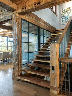 a wooden stair case in a large room