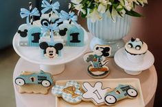 mickey mouse cookies and other decorations on a table