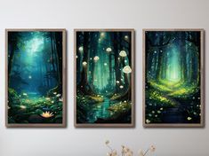 three paintings on the wall of a room with flowers in front of them and lights hanging from the ceiling