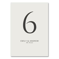 the number six is printed on a white card