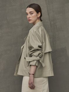 Editor's NotesShort length trench jacket from Maison de Ines. This features a casual and comfortable design wear that is great to style with various of inner wears as a jacket.- Crispy cotton material trench jacket- Half length light weight wear- Light weight cotton material great to style for summer- Ribbon detail on the sleeve- Loose fit silhouette minimal wearMeasurements(in.)One size (xs-m)- Total length: 24.61 in.- Chest: 22.64 in.- Sleeve length: 28.74 in.*Mod Chic Oversized Cotton Outerwear, Chic Cotton Utility Jacket For Work, Chic Cotton Outerwear For Everyday, Chic Everyday Cotton Outerwear, Trendy Spring Outerwear With Belted Cuffs, Chic Cotton Outerwear With Lapel Collar, Beige Outerwear With Belted Cuffs For Spring, Beige Belted Cuffs Outerwear For Spring, Beige Cotton Outerwear For Spring