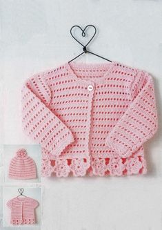 a crocheted sweater and hat are hanging on a hook