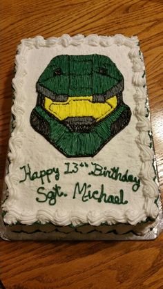 a birthday cake with a green and yellow mask on it