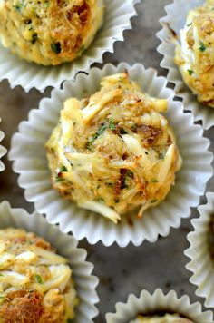 several muffins with cheese and herbs in paper cups