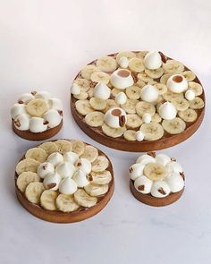 there are three desserts with bananas and nuts on them