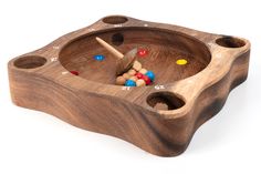 a wooden game set with balls in it