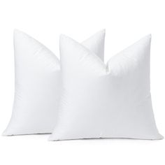 two white pillows sitting next to each other