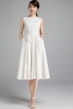 "This Off white linen dress features a fit and flare silhouette , pleated neckline . A must have lady midi dress, wearing this vintage inspired dress is a fashionable chance worth taking. DETAILS * Soft Linen, Medium weight Linen * 50% linen , 50% cotton * Cotton lining on upper part * Seam pockets * Boat neckline * Back zip closure * Sleeveless dress * Fit and flare dress * Below Knee Length * Summer, Spring * Wash by hand or machine with cold water, Ironing after dry * More color Choice and Mo Elegant Cotton A-line Sundress, Elegant Knee-length Beige Sundress, Elegant Beige Knee-length Sundress, Beige A-line Sleeveless Sundress, Beige Sleeveless Midi Cotton Dress, Beige Cotton Sleeveless Midi Dress, Elegant White Cotton Sleeveless Dress, Elegant White Sleeveless Cotton Dress, Elegant Beige Cotton Sundress