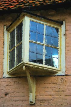 a window on the side of a brick building