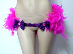 a female mannequin with pink and purple feathers on it's hipsocks