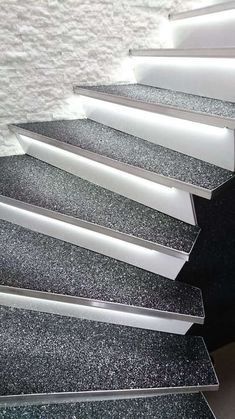 an image of a stair case that is made out of plexed glass and granite