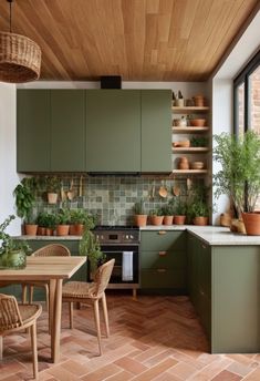 In 2024, there’s a strong emphasis on biophilic design, which incorporates natural elements into interiors. Earthy greens paired with natural materials create a serene and organic kitchen environment. #BiophilicDesign #EarthyGreens #NaturalMaterials #KitchenDesign #HomeDecor #KitchenInspiration #ModernKitchens #2024Trends #InteriorDesign #KitchenRemodel #OrganicKitchens #SereneSpaces #HomeStyling #NatureInspired #KitchenTrends Wood White Green Kitchen, Green Theme Kitchen Ideas, Earthy Color Kitchen, Nature Theme Kitchen, Interior Design Emphasis, Warm Green Kitchen, Green Kitchen Color Palette, Kitchen 2024 Design Trends, Kitchen Design 2025