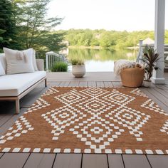 a brown and white rug sitting on top of a wooden floor next to a couch