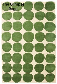 a green rug with circles on it and the words, the glimpse rugs written in white