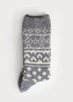 A classic Scandinavian women's boot sock knit with a non-itch wool blend and heavier gauge needles for extra comfort and coziness. Pairs perfectly with your favourite winter boots! Details: Size Guide One size fits most.Recommended Women's US shoe size 6-10, Euro 36 - 41. Materials 54% Polyester, 19% Nylon, 19% Acrylic, 6% Wool, 2% SpandexMade in China Care Instructions Machine wash cold, no chlorine bleach,hang dry recommended. Winter Knitted Socks For Stocking Stuffers, Scandinavian Style Winter Socks With Fair Isle Pattern, Comfortable Knitted Winter Socks, Snug Comfortable Winter Socks, Warm Knit Comfortable Socks, Nordic Knitted Winter Socks, Winter Nordic Knitted Socks, Comfortable Knitted Gray Socks, Cozy Warm Socks For Cold Weather