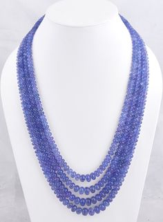 980 CT. 4 Strands Tanzanite Necklace/Layering Necklace/Gemstone Necklace/Beaded Necklace/Gift For Her/Birthstone Necklace/Women Necklace Measurement Specification- Size- 5-12mm Approx. Gemstone- Natural Tanzanite Shape- Rondelle Quality- AA Weight- 980 Ct. Cut- Smooth Drill- Center Color- Blue Length- 16 Inches Shortest Length                18 Inches Longest Length 980 CT. 4 Strands Tanzanite Necklace is a luxurious and captivating piece of jewelry, perfect for commemorating special occasions like anniversaries or as a thoughtful birthstone necklace for her. Crafted with meticulous attention to detail, this necklace features four strands of exquisite tanzanite gemstone beads, creating a stunning and dynamic layered effect. Tanzanite is a rare and highly prized gemstone known for its mesme Stone Beads Necklace, Tanzanite Necklace, Stone Beaded Necklace, Gemstone Beaded Necklace, Necklace Layering, Tanzanite Gemstone, Blue Tanzanite, Women Necklace, Natural Tanzanite