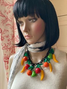 "MARION GODART Paris Dangling Colorful Summer Fruit Bib Necklace French Resin Costume Jewelry This listing is for the necklace. So chic! Colorful resin fruit bib necklace designed by Marion Godart Paris. It features playfully crafted dangling banana's, appels, pears, oranges and green leaves on a black wide shackled resin link chain closing with a red oversized hook. Measures 24\". Old stock, never been worn. Made in France This necklace is well made, very avant garde and artistic! Listing is fo