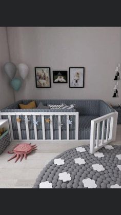 a baby's room is decorated in gray and white