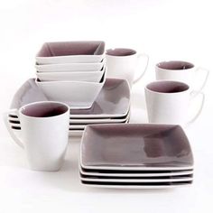 a set of white and grey dishes with cups