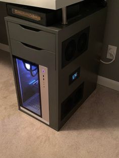 a computer tower sitting on top of a carpeted floor