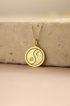 Gold Moon And Sun Pendant - Moon And Sun Gold Necklace ● Material of pendant: Solid Gold 14k ( REAL GOLD ) ● Metal Stamp: 14k ( REAL GOLD ) ● The pendant is available in 5 sizes: - 12,7 mm / 0.5 inches (Diameter) - 14,0 mm / 0,55 inches ( Diameter ) In the photos - 15,3 mm / 0.6 inches ( Diameter ) - 16,5 mm / 0,65 inches ( Diameter ) - 19,1 mm / 0,75 inches ( Diameter ) ( In the photos the size is 14mm / 0.55 inches Diameter ) ( Jump Ring inner diameter: 4 mm ) ● Material of chain: Solid gold 14k ( REAL GOLD ) It is thin and dainty and it is available in 4 sizes: - 40 cm / 15,75 inches ( Length ) - 45 cm / 17,72 inches ( Length ) In the photos - 50 cm / 19,68 inches ( Length ) - 55 cm / 21,65 inches ( Length ) ● Backside engraving is FREE ( Please use the personalization box for that.) ● Sun Moon Pendant, Dainty Yellow Gold Necklace With Sun And Moon Design, Crescent Coin Pendant Necklace As Gift, Celestial Round Necklaces For Anniversary, Celestial Round Necklace For Anniversary, Symbolic Round Charm Necklaces Tarnish Resistant, Yellow Gold Necklace With Moon Charm Gift, Symbolic 14k Gold Necklace With Moon Charm, Symbolic 14k Gold Jewelry With Moon Charm