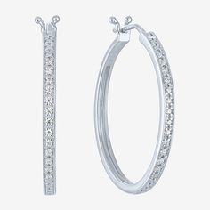 Add a touch of sparkle to your jewelry collection with these stunning 1/10 CT. T.W. Natural Diamond Hoop Earrings, elegantly crafted in sterling silver. Featuring a sleek and timeless design, each earring showcases a series of round, prong-set diamonds that create a beautiful shimmer. The hinged back ensures a secure and comfortable fit, making them perfect for everyday wear or special occasions. Packaged in a lovely gift box, these earrings make a thoughtful gift for someone special, especially Small Hoop Diamond Earrings With Accents, White Sparkling Hoop Earrings As Gift, White Sparkling Hoop Earrings For Gift, Sparkling White Hoop Earrings As Gift, White Hoop Jewelry With Channel Set, White Channel Set Hoop Jewelry, Classic Sparkling White Gold Hoop Earrings, Sparkling Round Hoop Earrings As Gift, Sparkling Round Hoop Earrings For Gift