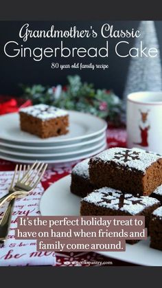 some brownies are on a white plate with powdered sugar