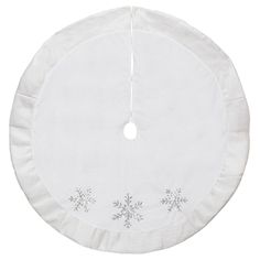 a white snowflaked christmas tree skirt