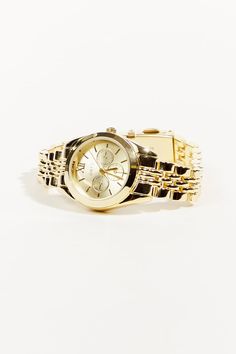 Keep time in style with this watch. This chic watch features a sleek gold link band and a round face that is both classic and modern. Whether you're dressing up for a night out or just running errands, this watch is the perfect accessory to complete your look. Gold Link, Altar'd State, Round Face, Running Errands, In Style, Watch Bands, Night Out, Sleek, Running