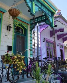 a bicycle is parked in front of a colorful house