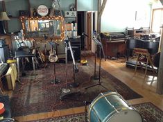 a room filled with lots of musical equipment