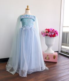 This sky blue dress is a dream.  Its perfect for any special occasion a girls dress to wear to a wedding.  This blue ball gown is perfect for walking the runway at a girls pageant dress. Wherever you little princess is going to, she will be the bell of the ball! Only 1 available size 6 to small 8 This dress if made with blue bridal lace and lined with blue lycra.  The cape is made with brooch pins and is removable! So you get 2 dressing in 1! READY TO SHIP NOW. If you have any other questions please feel free to contact me.  Also you can follow me on all social platforms @Pinkerflies Princess Dress With Lace Bodice For Prom Season, Organza Princess Dress With Fitted Bodice For Prom, Pageant Princess Dress With Tulle Skirt And Fitted Bodice, Prom Season Princess Dress With Lace Bodice, Pageant Ball Gown With Tulle Skirt And Fitted Bodice, Fitted Bodice Ball Gown With Tulle Skirt For Pageants, Prom Season Ball Gown Pageant Dress With Tulle Skirt, Princess Organza Dress For Pageant, Princess Tulle Pageant Dress For Prom Season