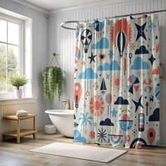 a bathroom with a bathtub, shower curtain and rug on the floor in front of it