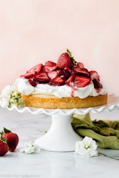 strawberry shortcake with whipped cream and fresh strawberries on the top, ready to be eaten