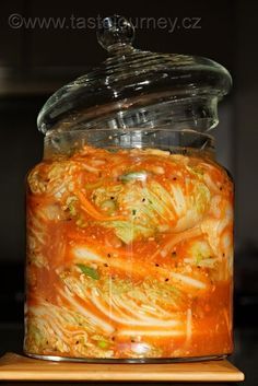 a glass jar filled with food sitting on top of a counter